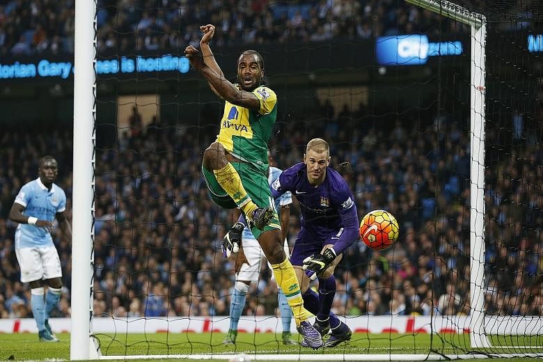 Norwich City's Cameron Jerome pounces on a fumble from Manchester City custodian Joe Hart to equalise the score at 1-1. But City earned an 89th-minute penalty, converted by Yaya Toure, to pick up the three points.