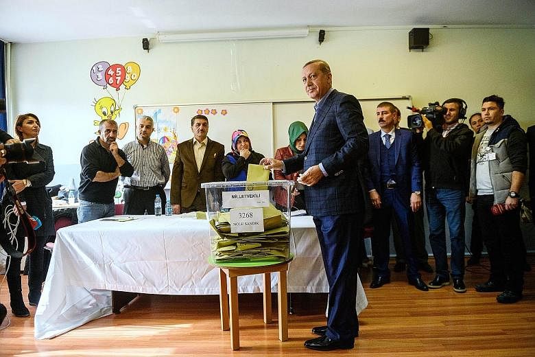 President Recep Tayyip Erdogan casting his ballot in Istanbul. Yesterday's election is one of Turkey's most crucial elections in years, with the country deeply divided in the face of surging Kurdish and Islamic violence and concerns about democracy a