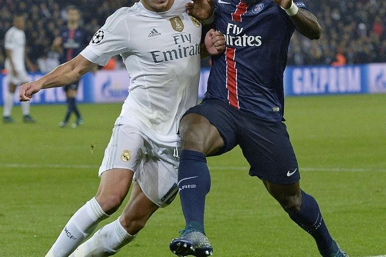 Jese Rodriguez (left), tussling with PSG defender Serge Aurier in their Oct 21 Champions League clash, has been fielded by Real Madrid, who are facing a mini injury crisis involving their top players.