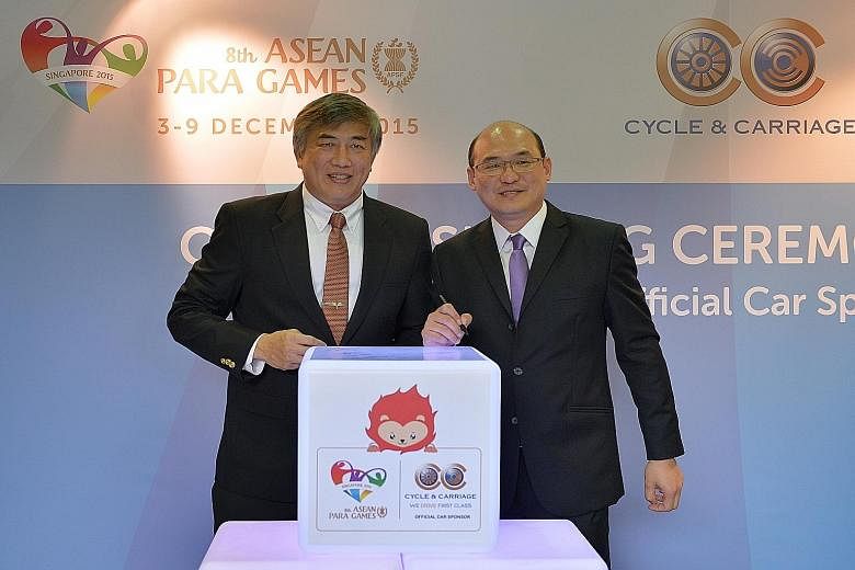 Lim Teck Yin (left), Singapore Asean Para Games Organising Committee chairman, with Eric Chan, C & C managing director (Singapore Motor Operations). The vehicle sponsorship for next month's event - the first time the Republic is hosting it - is worth