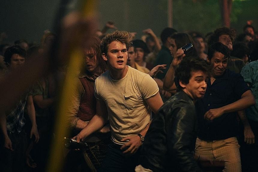 Jeremy Irvine (in white) in Stonewall, which tells the story behind the gay rights riots.