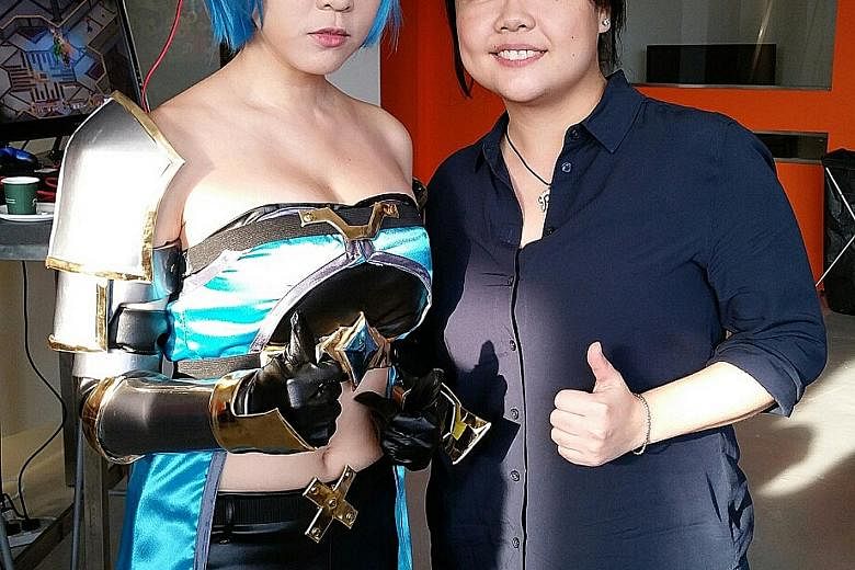 GameStart founder Elicia Lee (right) with the event's mascot Alyse, played by Ms Sharlene Tan. Ms Lee is bullish about this year's convention.