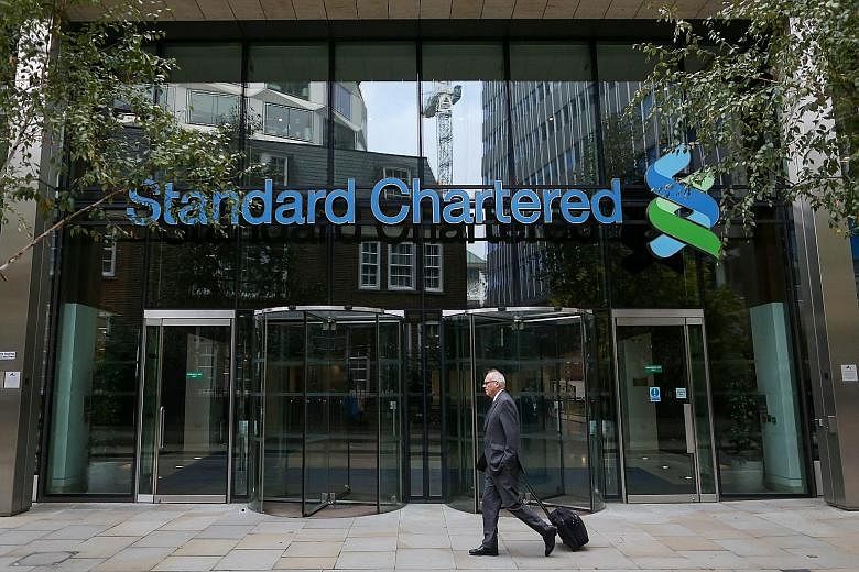 The StanChart headquarters in London. Seeking a turnaround in fortunes, the company is now axing 15,000 jobs and is being forced to ask investors for US$5.1 billion (S$7.1 billion).