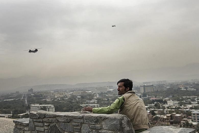 Helicopters in Kabul ferrying people working with the US and international coalition to their offices and back, as a security blimp keeps watch over the city. The helicopter transport is just one measure of how things have changed in the Afghan capit