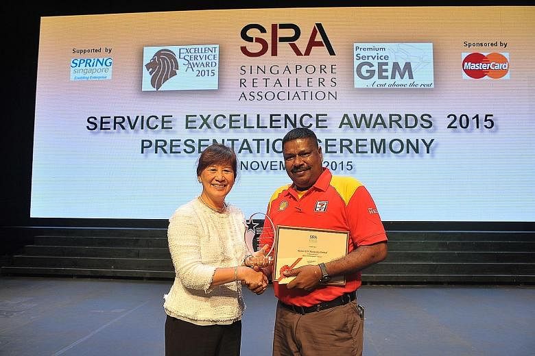 SRA honorary secretary Helen Khoo with Mr Kumar Munasamy Perimal, who won the Service Superstar award yesterday.