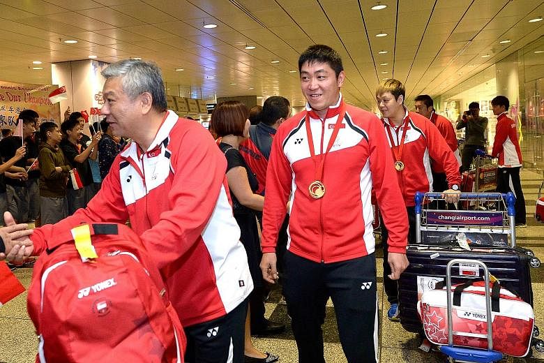Yang Chuanning (left), with national player Gao Ning after returning from a tournament, feels he is an innocent victim of the internal turmoil in the Singapore Table Tennis Association. However, it is understood that the players have voiced their unh