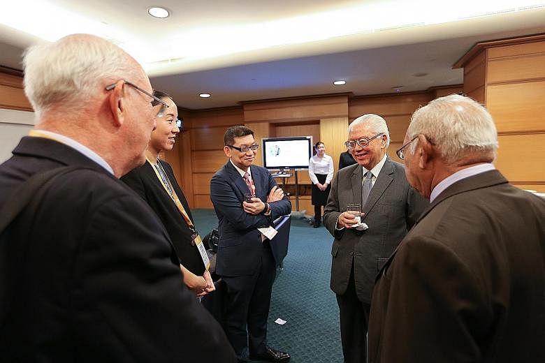 President Tan (second from right) at a tea reception during the conference of the Nobel Prize Series yesterday. He said students must be equipped with the competencies to thrive in the workforce of the future.