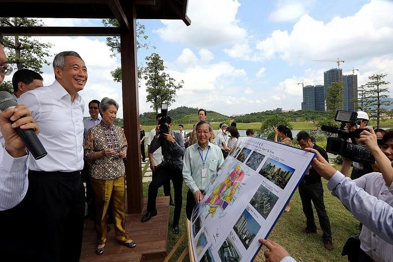Prime Minister Lee Hsien Loong at the Guangzhou Knowledge City site with his wife Ho Ching last year.
