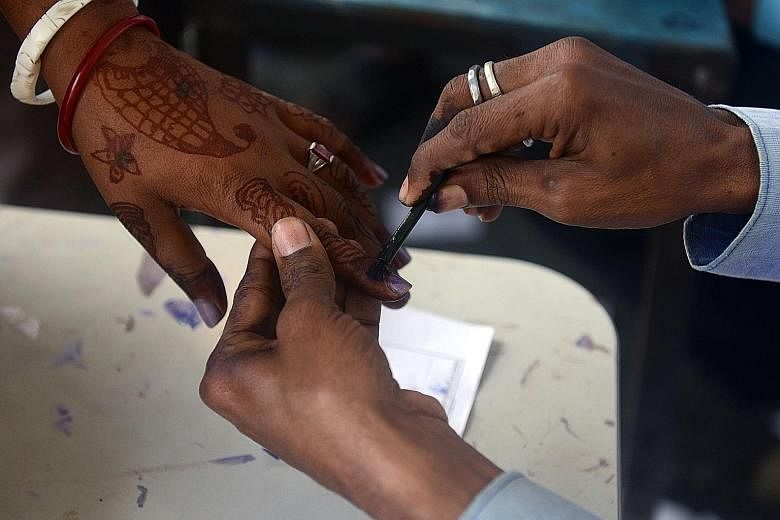 A woman in the village of Thakurganj in Bihar getting an ink mark on her finger to indicate that she has voted. Mr Modi was the face of the BJP's election campaign in Bihar and addressed more than 25 rallies.