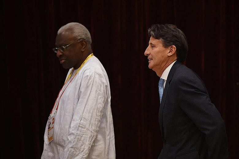Outgoing IAAF president Lamine Diack with newly elected chief Sebastian Coe at the Beijing congress in August. The 82-year-old Senegalese, out on bail, is suspected of accepting bribes to cover up positive Russian dope tests.