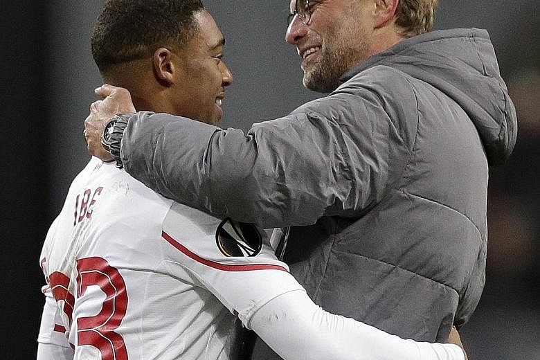 Manager Juergen Klopp (right) is happy with Jordon Ibe after the forward netted to give Liverpool a crucial 1-0 win over Rubin Kazan in the Europa League on Thursday.