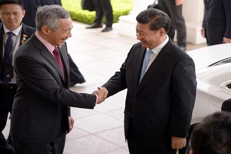 PM Lee Hsien Loong (left) receiving Chinese President Xi Jinping at the Istana. In a Facebook post, Mr Lee said he had a fruitful meeting with Mr Xi, whose two-day state visit further deepened the bilateral relationship.