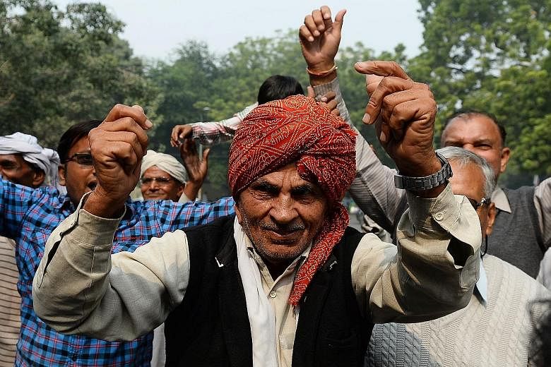 Janata Dal (U) supporters celebrating after an alliance, led by their party, won the Bihar state polls.