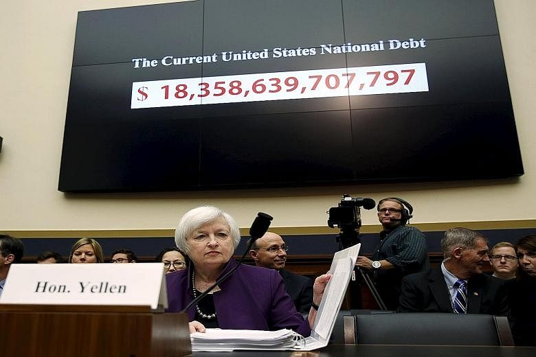 Fed chief Janet Yellen getting ready to testify before the US House Financial Services Committee in Washington DC last Wednesday. She said a rate hike would be "the prudent thing to do".