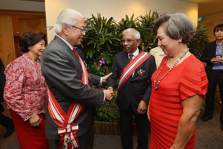 President Tony Tan Keng Yam with former Cabinet minister S. Dhanabalan, who received the Order of Temasek (First Class) last night. With them are Mrs Mary Tan (left) and Mrs Christine Dhanabalan.