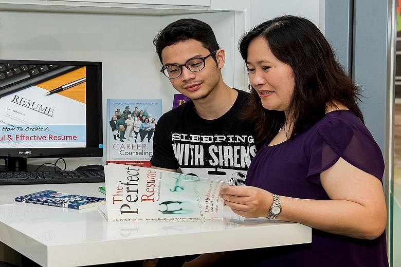 Student Muhammad Dinie Zaini getting advice on his future career paths from Ms Janice Chua, a counsellor at Nanyang Polytechnic's Education and Career Guidance Centre. The polytechnic has also signed agreements with industry partners to offer a struc