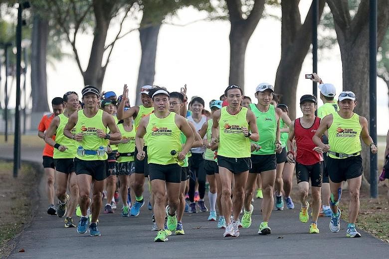 Members of running group Team FatBird out in force at East Coast Park yesterday morning. The group had to cancel almost three-quarters of its weekend marathon training sessions and weekday group runs owing to the unhealthy haze conditions in Septembe