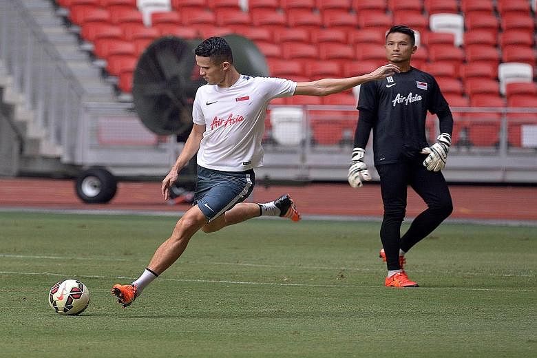Baihakki Khaizan (left) and Hassan Sunny during a training session at the National Stadium yesterday. The Lions will host Japan in their 2018 World Cup qualifier on Thursday.