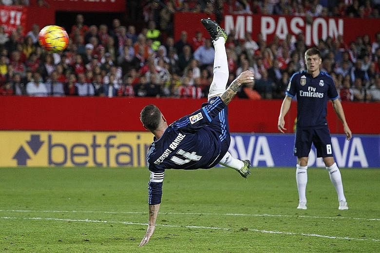 Real Madrid drew first blood against Sevilla on Sunday through this shot from defender Sergio Ramos, but went on to lose 2-3. Real will face Barcelona, who are now three points clear, on Nov 21.