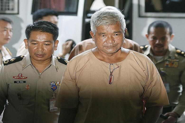 Manas Kongpan, the most high-profile defendant, entering court yesterday.