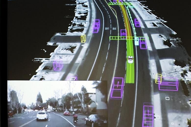 Video footage (inset) captured by a Google self-driving car, coupled with data of the same street as visualised by the car, being shown at a Google presentation in Mountain View, California, in September. Analysts believe self-driving cars overseen b