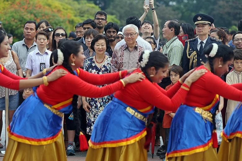 President Tony Tan Keng Yam and his wife, Mrs Mary Tan, watching an Indian dance performance by PAssionArts' Sembawang Silver Stars group at the Istana open house yesterday, in celebration of Deepavali.
