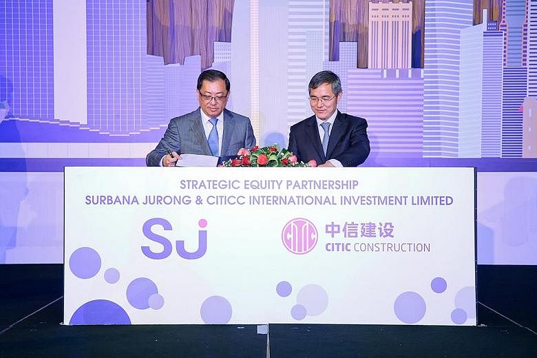 Surbana Jurong group chief executive Wong Heang Fine (left) with Mr Xu Ming Guang, assistant president of Citic Construction and director of CITICC (Africa), yesterday at Surbana Jurong's brand launch. Surbana is investing $85.4 million to get 20 per