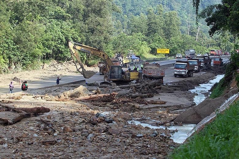 Mud, rocks and trees lie across all four lanes of the highway linking Kuala Lumpur to the eastern state of Pahang. Clean-up works are expected to take two days and the affected stretch of the highway will remain closed until further notice.