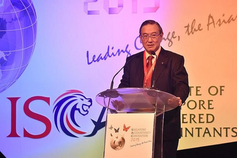 Isca president Gerard Ee speaking at the Singapore Accountancy Convention yesterday. The national accountancy body is broadening its membership rules.