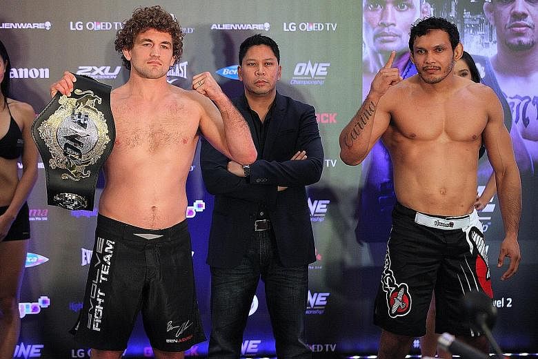 One FC Championship welterweight title holder Ben Askren (left) weighed in at 169.5 pounds - a shade under the 170-pound (77.1kg) limit - at the weigh-in at Bugis+. But his opponent Santos ran afoul of the scales, coming in at 172 pounds. He will be 