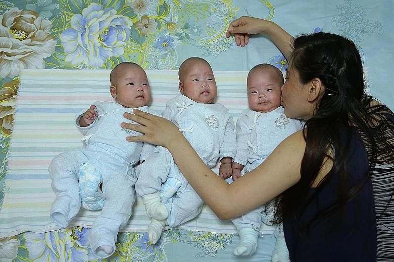 Madam Ning Lei gave birth to her girls in July and her in-laws visited her at the hospital twice, she said. She has not been able to register the babies' births as she needs her husband's identity card.