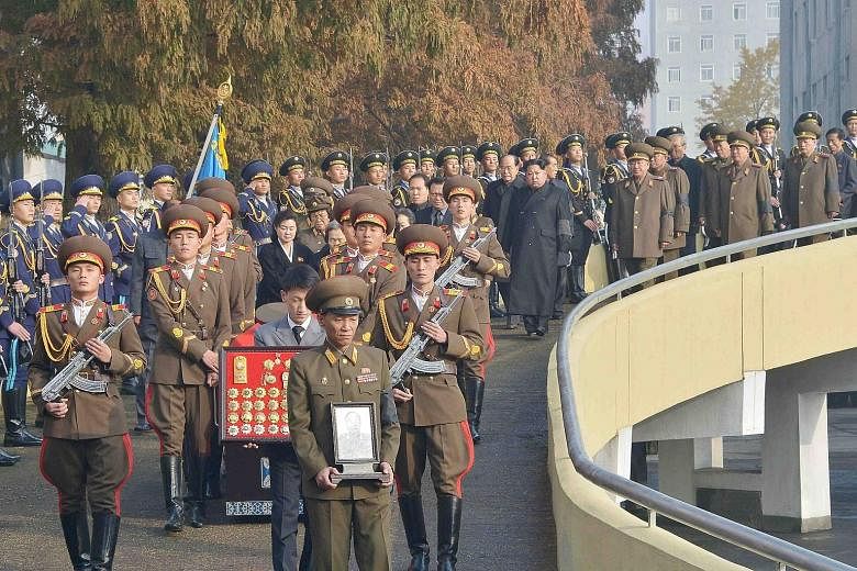 North Korean leader Kim Jong Un (right, in dark coat) at the state funeral of Korean People's Army marshal Ri Ul Sol in Pyongyang, in an undated photo released by North Korea's Korean Central News Agency on Thursday.
