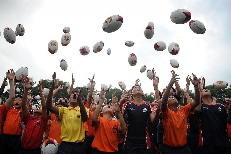 The school-based "Pass It On" programme reflects SRU president Low Teo Ping's desire that every young player should own a rugby ball.