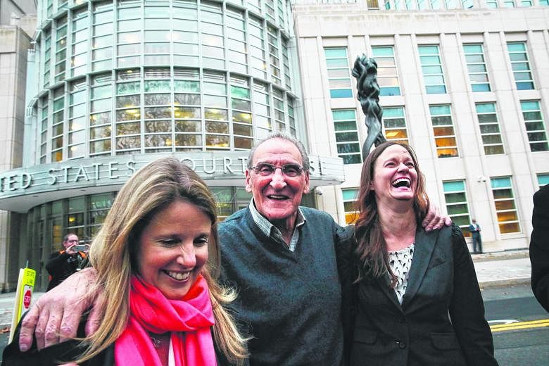 Mr Vincent Asaro, 80, seen here with his lawyers, raised his hands in the air and shouted "Free!" outside the court in Brooklyn after a jury found him not guilty on Thursday.