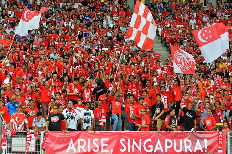 Singapore fans mostly all decked in red, showing their support for the Lions during the Singapore-Japan Group E World Cup qualifier on Thursday.
