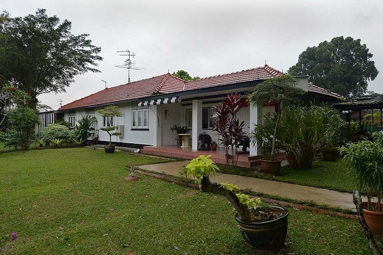 The black-andwhite bungalows (above) used to house British Royal Air Force servicemen and their families. (Left) One of several barracks in Seletar.