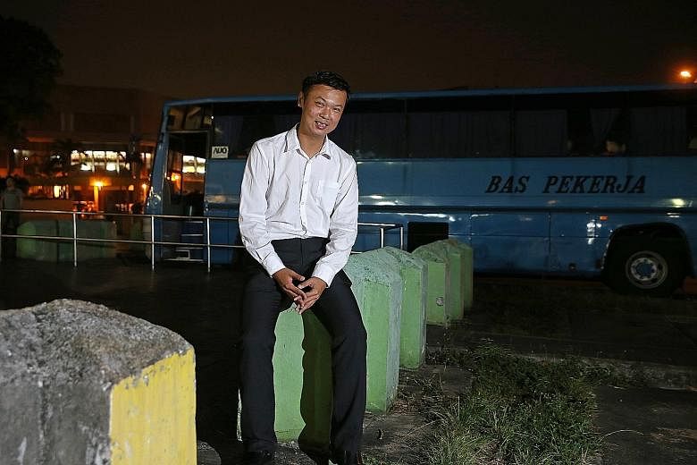 Bus spotter Bernard Wee at his favourite spot, a former bus interchange in Woodlands Centre Road. The berths are now occupied by private buses and heavy vehicles.
