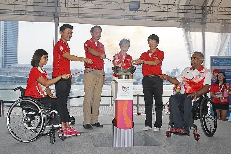Above, from left: Para sailor Yap Qian Yin, Parliamentary Secretary Baey Yam Keng, Deputy Prime Minister Teo Chee Hean, Minister for Culture, Community and Youth Grace Fu, Dr Teo-Koh Sock Miang (chairman, Singapore National Paralympic Council) and Ra