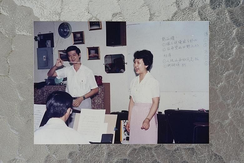 An old photo of Mr Ang Lam Seng, then Zhong Yi Traditional Orchestra's conductor, with a young Ms Peng Liyuan, taken during her visit to Singapore in 1987. Members of the orchestra who met Ms Peng Liyuan included (from left) Mr Ang Lam Seng, Mr Lim B