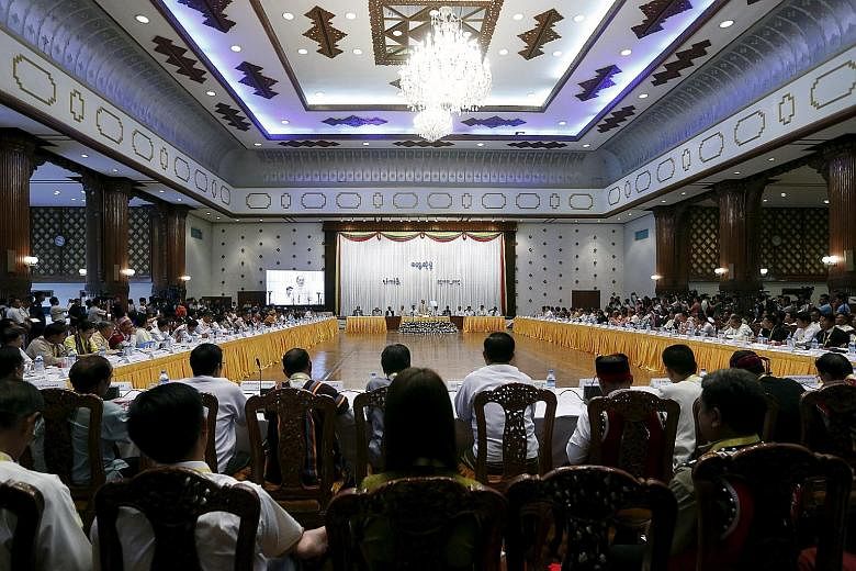 Myanmar President Thein Sein (above) speaking at a meeting of nearly 90 political parties in Yangon yesterday. The former junta general appeared sanguine about the resounding defeat of his army-backed Union Solidarity and Development Party, which wil