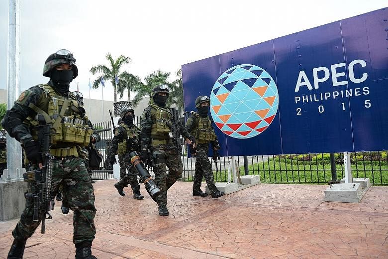 Members of the Philippines' Special Action Force at the Apec summit venue in Manila after a drill last Saturday. The capital is on lockdown, as more than 7,000 world leaders and delegates have begun gathering there for the annual series of meetings f
