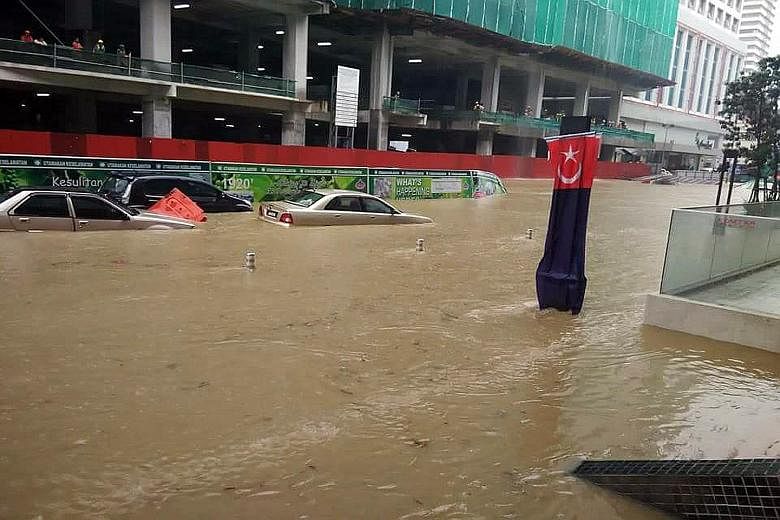 Dozens of cars were trapped in the deluge, while some shops in the lower levels of the city centre were flooded. The City Square Johor Baru shopping complex and Komtar JBCC were among those affected.