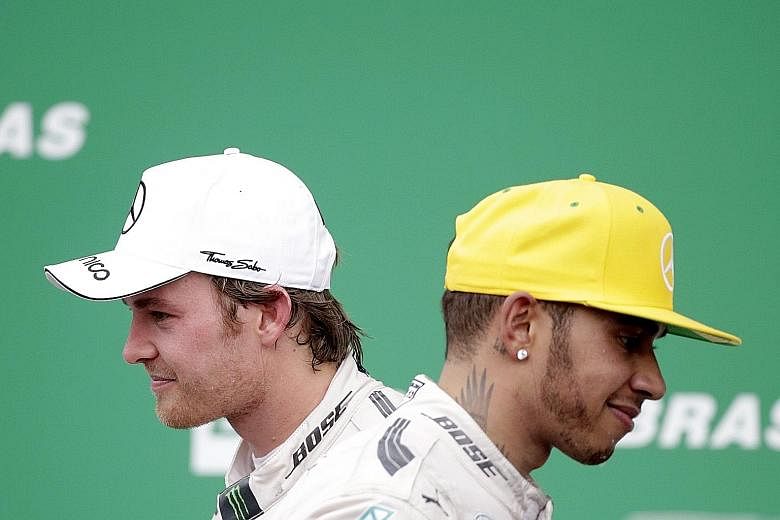 Mercedes team-mates Nico Rosberg (left) and Lewis Hamilton on the podium after the Brazilian GP, with the German denying the British world champion a first win in Sao Paulo. Rosberg says he has raised his game in the past two months and tyre pressure