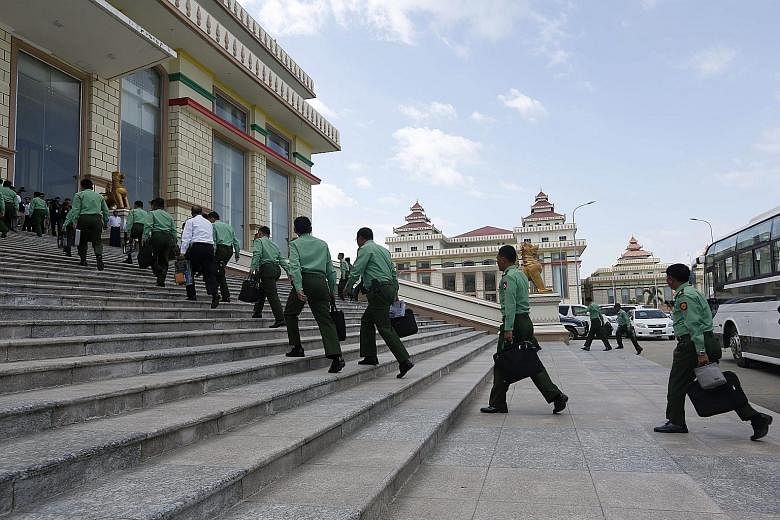 Military representatives arriving for a session of the Parliament in Naypyitaw, Myanmar, yesterday. Even though the National League for Democracy party has won the recent election, the powerful military still has a constitutionally guaranteed 25 per 