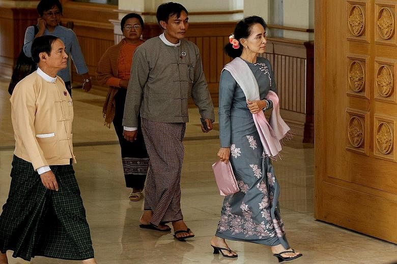 Military representatives arriving for a session of the Parliament in Naypyitaw, Myanmar, yesterday. Even though the National League for Democracy party has won the recent election, the powerful military still has a constitutionally guaranteed 25 per 