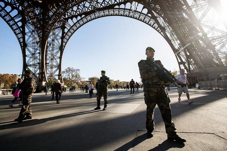 Morrocan Ayoub El Khazzani and Frenchman Mehdi Nemmouche are said to have links to the Belgian town of Molenbeek. (Above) Soldiers patrolling the Eiffel Tower in Paris on Sunday as the search goes on for terrorists. (Left) A picture from the February