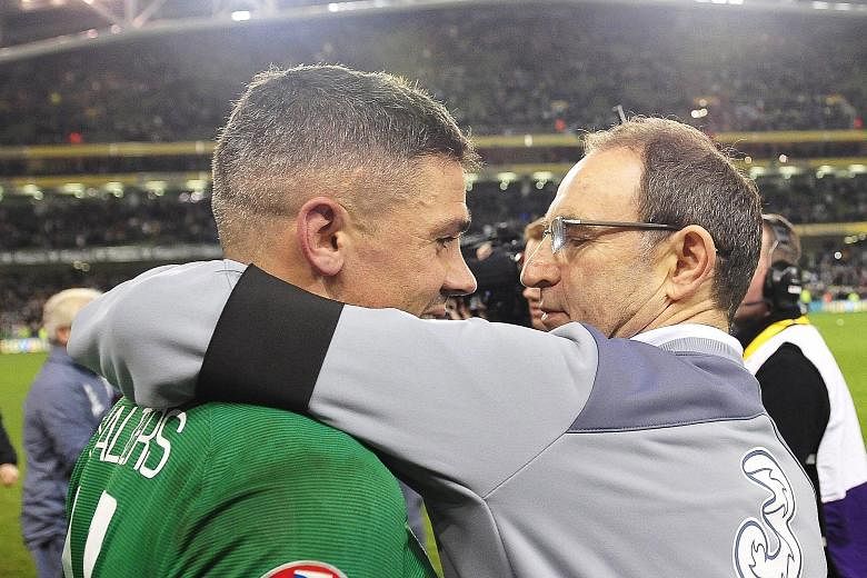 Ireland manager Martin O'Neill (left) celebrates with Jon Walters after the 2-0 win against Bosnia and Herzegovina in Dublin on Monday. Ireland sealed a Euro spot with a 3-1 aggregate victory.