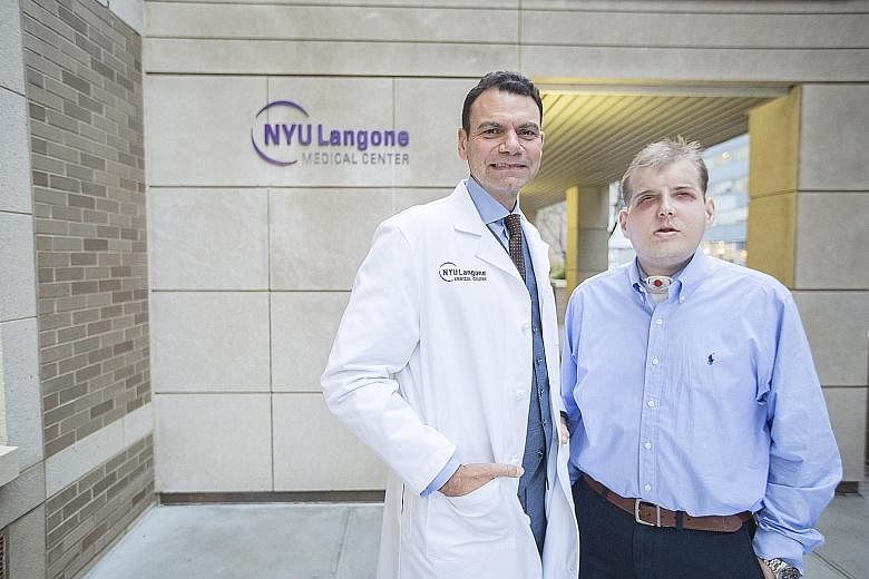 Mr Patrick Hardison with Dr Eduardo Rodriguez, who led a team of more than 100 doctors, nurses and medical staff in the 26-hour face transplant operation at NYU Langone Medical Centre in New York.