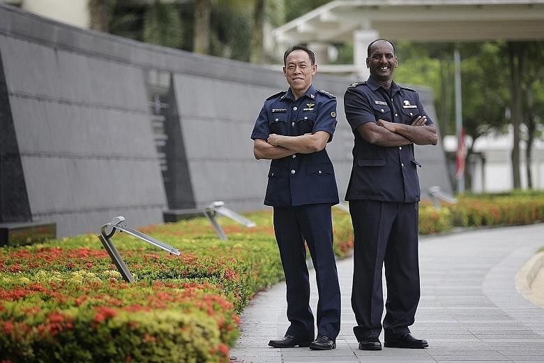 Singapore Prison Service Superintendent Ong Aik San (far left) received a Long Service Medal, while Singapore Civil Defence Force Warrant Officer Veeramani Prelathan got an Efficiency Medal at the Ministry of Home Affairs Investiture Ceremony yesterd
