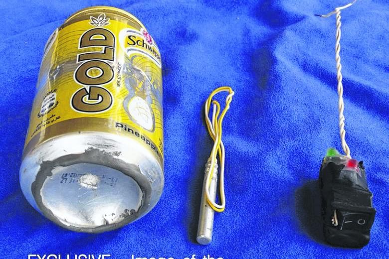 The Islamic State in Iraq and Syria's (ISIS) official magazine has carried a photo (above) of a soft drink can and what appeared to be a detonator and switch that it said were used to make an improvised bomb that brought down a Russian airliner over 